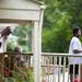 Neighbors watch the scene of a house explosion from their porch on Sunday, July 7. Daniel Brenner I AnnArbor.com